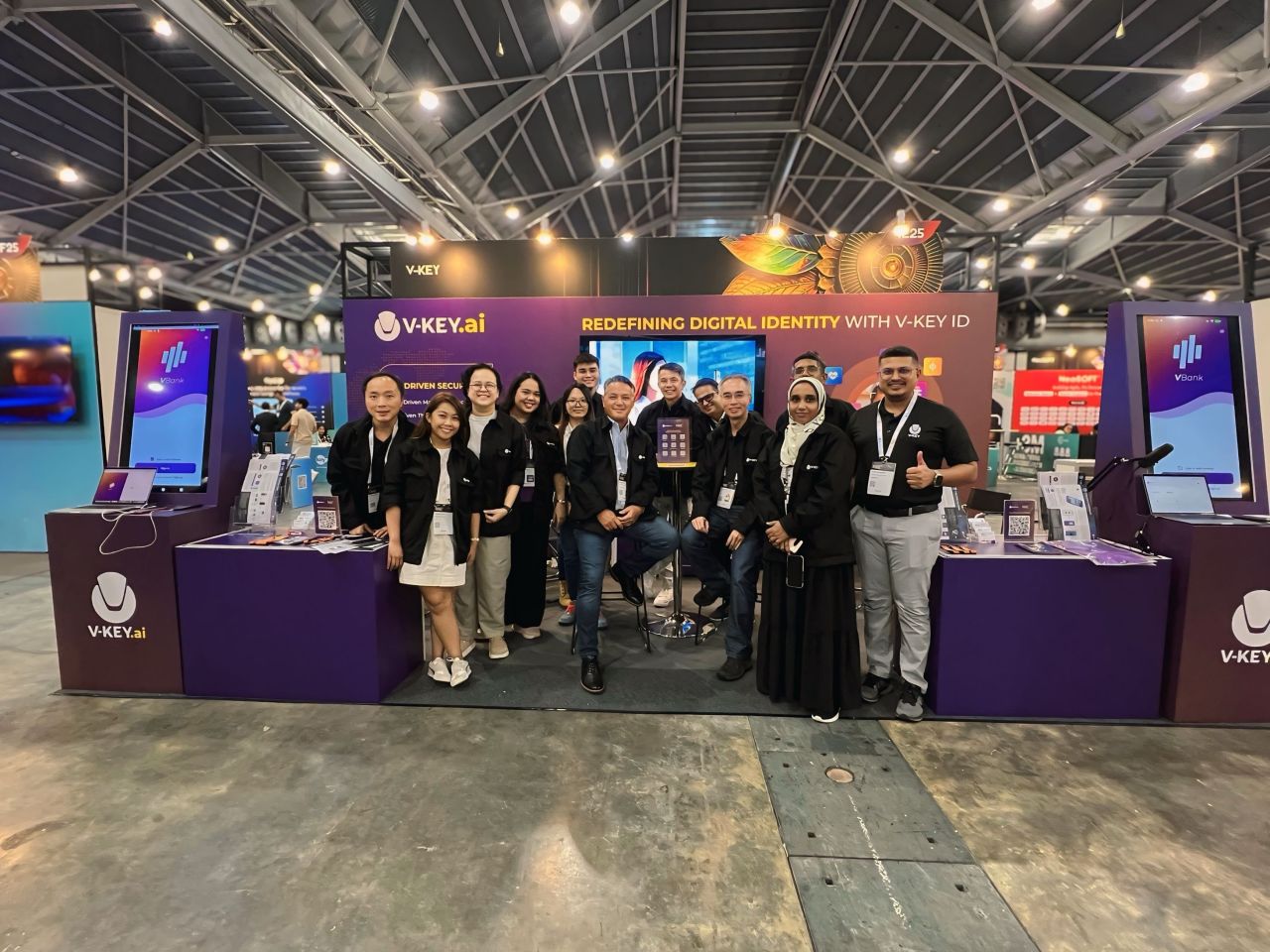 V-Key team at tech conference booth